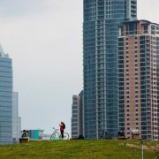 Bicyclists take a break below new buildings in Austin, Texas, on April 3, 2015. About 900,000 people live in Austin and the city expects that number to reach nearly 1.3 million by 2040. Austin and San Antonio are the twin anchors of a region that is experiencing the fastest growth in the United States. (Matthew Busch/Bloomberg)